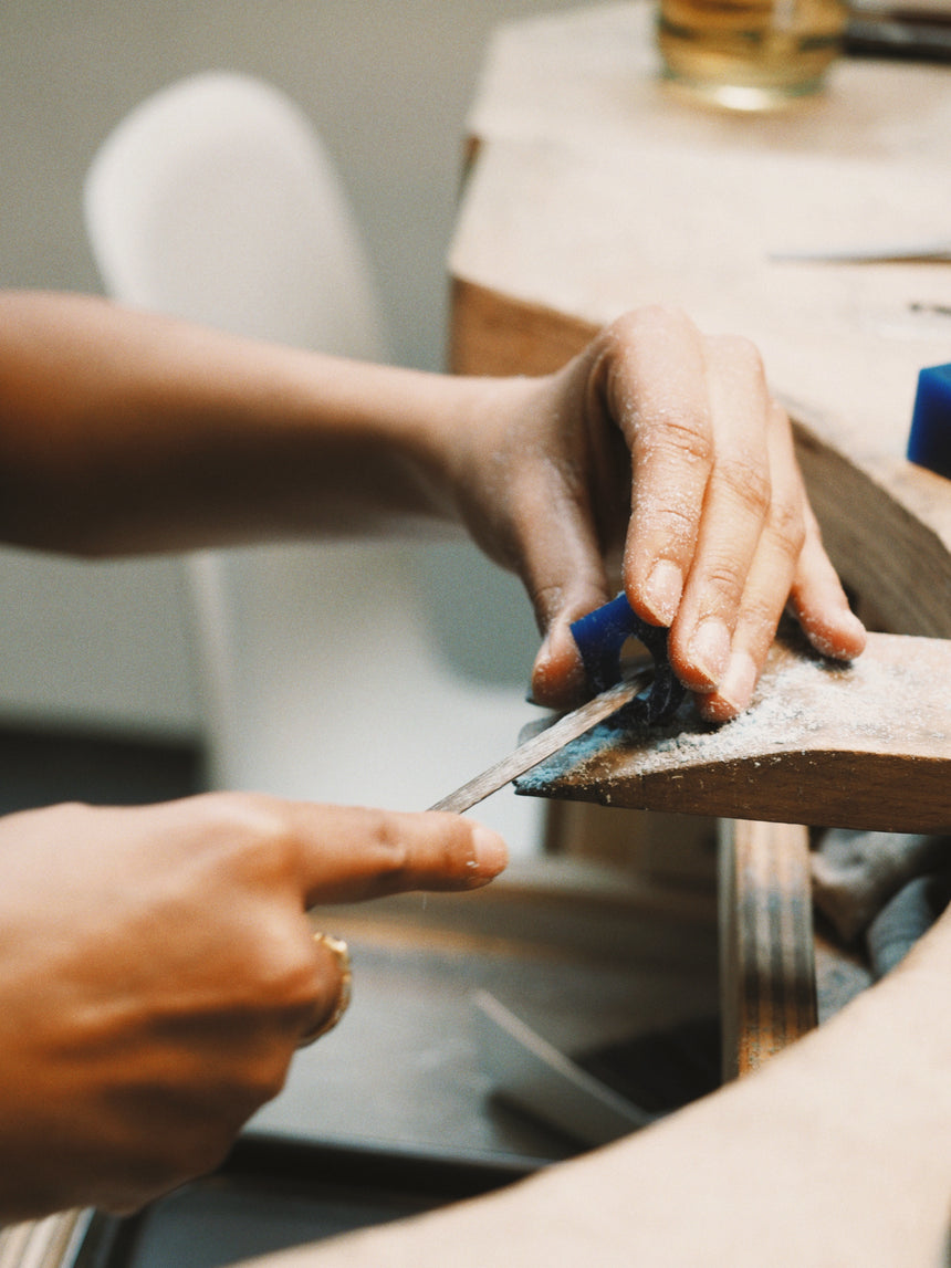 Carving a signet ring in wax 